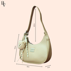 Beige handbag with measurements on a light pink background