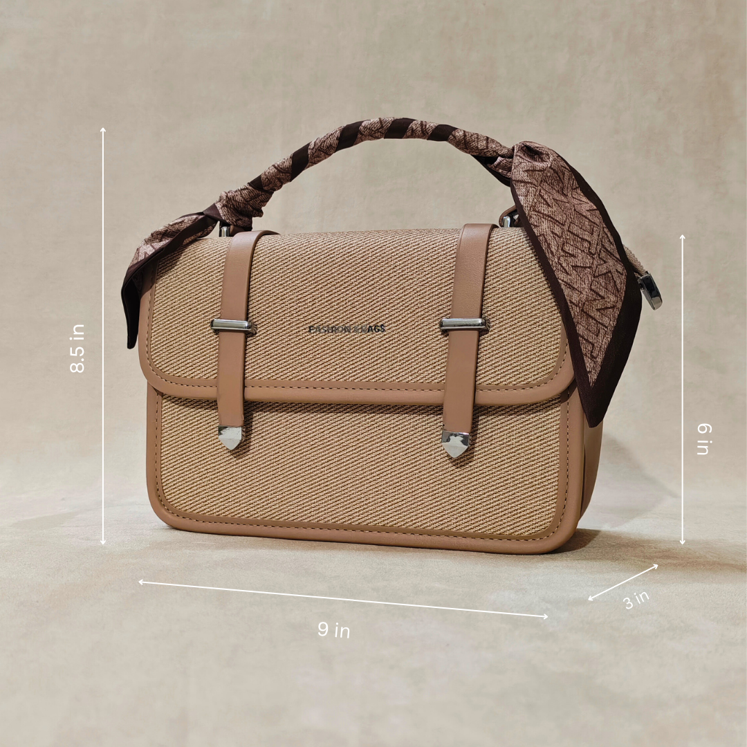Beige handbag with decorative strap on a beige background, showing dimensions.