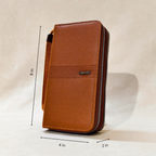 Brown leather phone case with measurements on a beige background