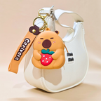 Small pouch with a bear keychain featuring a strawberry on a beige background