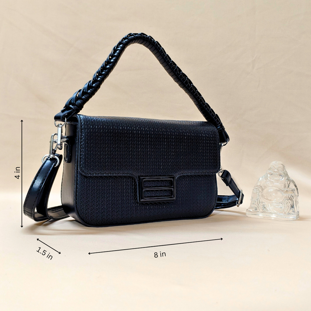 Black textured handbag with braided handle on a beige background, featuring measurements.