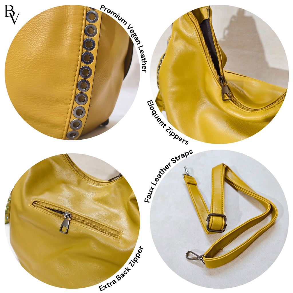 Yellow vegan leather handbag with zippers and straps on a white background