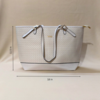 Beige handbag with dimensions displayed on a beige background