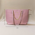 Pink handbag with gold chain strap and measurements on a beige background