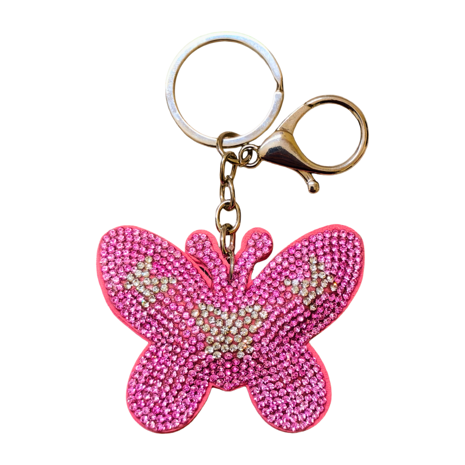 Pink butterfly keychain with rhinestones on a white background