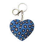 Heart-shaped keychain with blue and black pattern on a white background