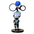 Action figure keychain with character holding a weapon on a white background